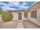 Exterior view of home featuring a barred front door and windows at 2200 Stanley Ave, North Las Vegas, NV 89030