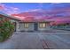 This exterior presents a quaint, single-story home with desert landscaping and secure front entry at 2200 Stanley Ave, North Las Vegas, NV 89030