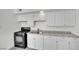 Kitchen featuring white cabinets, granite countertops, and stainless steel appliances at 2200 Stanley Ave, North Las Vegas, NV 89030
