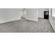 A bright open-concept with modern flooring, paint, and lots of natural light at 2200 Stanley Ave, North Las Vegas, NV 89030