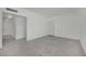 This spacious living room features modern tile floors and neutral-colored walls at 2200 Stanley Ave, North Las Vegas, NV 89030