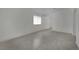 This living room features modern tile floors and neutral-colored walls at 2200 Stanley Ave, North Las Vegas, NV 89030