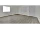 Bright and airy living room with new flooring, fresh paint, and natural light at 2200 Stanley Ave, North Las Vegas, NV 89030