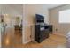 Bedroom with wood floors connects seamlessly to the living room, perfect for open-concept living at 2325 Windmill Pkwy # 323, Henderson, NV 89074