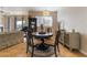 Comfortable dining area with a decorative chandelier, stylish furniture, and wood-look flooring at 2325 Windmill Pkwy # 323, Henderson, NV 89074