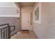 Exterior of a home with a welcoming entrance featuring a decorative door and textured facade at 2325 Windmill Pkwy # 323, Henderson, NV 89074