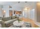 Bright living space featuring an open layout, comfortable seating, and seamless flow to kitchen and entryway at 2325 Windmill Pkwy # 323, Henderson, NV 89074