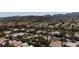 An aerial view of a neighborhood nestled against a backdrop of scenic mountains at 2544 Sundew Ave, Henderson, NV 89052