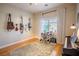 Well-lit room with hardwood floors, a window, and musical instruments at 2544 Sundew Ave, Henderson, NV 89052