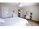 Bright bedroom with a ceiling fan, carpet floors, and a desk area that provides a comfortable workspace at 2544 Sundew Ave, Henderson, NV 89052