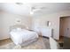 Well-lit bedroom includes a ceiling fan, carpet floors, and a dresser with a decorative mirror above it at 2544 Sundew Ave, Henderson, NV 89052