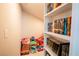 Organized closet with built-in shelving and storage for toys and books at 2544 Sundew Ave, Henderson, NV 89052