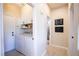 Functional laundry room with washer, dryer, and plenty of storage space at 2544 Sundew Ave, Henderson, NV 89052