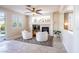 Bright living room with a cozy fireplace and two chairs perfect for relaxing at 2544 Sundew Ave, Henderson, NV 89052
