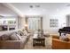 Open concept living room offers hardwood floors, recessed lights, and fireplace at 2544 Sundew Ave, Henderson, NV 89052