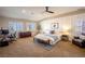 Cozy main bedroom with natural light, dresser, a desk, and ample space at 2544 Sundew Ave, Henderson, NV 89052