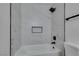 Bathroom with a modern, white tiled shower, with matte black shower head and trim at 2671 Diamante Cir, Las Vegas, NV 89121