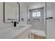 Bathroom with marble-style tile, modern fixtures, and a stand-up shower at 2671 Diamante Cir, Las Vegas, NV 89121