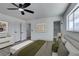 Modern bedroom featuring neutral decor, a ceiling fan, and lots of natural light at 2671 Diamante Cir, Las Vegas, NV 89121