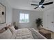 Well-lit main bedroom with soft bedding, a large window, and a stylish decor at 2671 Diamante Cir, Las Vegas, NV 89121