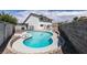 Backyard view of the kidney-shaped swimming pool with a spa and rock landscaping at 2671 Diamante Cir, Las Vegas, NV 89121