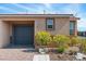 Attractive home with a two-car garage, desert landscaping, and a cozy front porch at 2685 Crystal Blue St, Laughlin, NV 89029