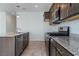 This kitchen has stainless steel appliances, granite countertops and an island at 2685 Crystal Blue St, Laughlin, NV 89029