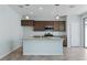 Bright kitchen features stainless steel appliances, granite countertops, and an island with pendant lighting at 2685 Crystal Blue St, Laughlin, NV 89029