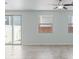 Bright living area with tile floors, sliding glass doors, and multiple windows at 2685 Crystal Blue St, Laughlin, NV 89029