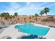 This pool has a no diving sign and is surrounded by palm trees at 2685 Crystal Blue St, Laughlin, NV 89029