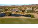 Aerial image of a secluded estate by a scenic pond and golf course, offering an exclusive retreat at 3 Anthem Pointe Ct, Henderson, NV 89052