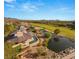 Breathtaking aerial view of an estate with a pristine golf course and pond, blending luxury with nature at 3 Anthem Pointe Ct, Henderson, NV 89052