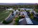 Captivating aerial view of a home, highlighting its waterfront location near golf course at 3 Anthem Pointe Ct, Henderson, NV 89052