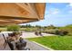 Picturesque backyard with a covered patio overlooking a lush lawn and golf course at 3 Anthem Pointe Ct, Henderson, NV 89052
