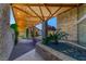 The entryway has stunning stone columns and lush greenery leading to the front entrance at 3 Anthem Pointe Ct, Henderson, NV 89052