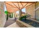 Inviting entrance with stone accents, a wooden canopy, and tranquil landscaping at 3 Anthem Pointe Ct, Henderson, NV 89052