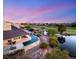 Expansive backyard with beautiful pool and lush green landscaping creates a private oasis at 3 Anthem Pointe Ct, Henderson, NV 89052