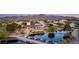 Stunning aerial view of a luxurious home featuring a pool, waterfront access and mountain views at 3 Anthem Pointe Ct, Henderson, NV 89052