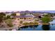 A picturesque view of an upscale home, boasting an inviting pool and scenic waterfront at 3 Anthem Pointe Ct, Henderson, NV 89052
