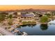Stunning home with a pool overlooking a lake, complemented by picturesque mountain views in the background at 3 Anthem Pointe Ct, Henderson, NV 89052