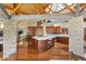 Open kitchen features a large island, wood cabinets and stone accents at 3 Anthem Pointe Ct, Henderson, NV 89052
