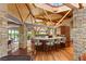 Spacious kitchen featuring a unique wood ceiling design, stone accents and stainless steel appliances at 3 Anthem Pointe Ct, Henderson, NV 89052