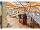 Elevated view of living area with stone walls and wood floors with dining at 3 Anthem Pointe Ct, Henderson, NV 89052