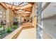Spacious living area with high ceilings, stone walls, and wood flooring at 3 Anthem Pointe Ct, Henderson, NV 89052