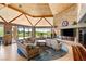 Bright living room features a cozy seating area, fireplace and outdoor views at 3 Anthem Pointe Ct, Henderson, NV 89052