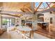 Open-concept living area with vaulted ceilings, stone accents, and access to the outdoors at 3 Anthem Pointe Ct, Henderson, NV 89052