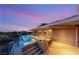 Covered patio with outdoor dining beside the infinity pool and spa overlooking the backyard at 3 Anthem Pointe Ct, Henderson, NV 89052