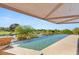 Stunning infinity-edge pool overlooking lush greenery and water features, perfect for relaxation at 3 Anthem Pointe Ct, Henderson, NV 89052