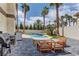 A backyard oasis with a pool, patio, outdoor kitchen, and ample space for entertaining at 3005 Stern Dr, Las Vegas, NV 89117