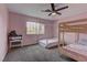 This cozy bedroom features neutral walls, a ceiling fan, a bunk bed, and a floor bed at 3005 Stern Dr, Las Vegas, NV 89117